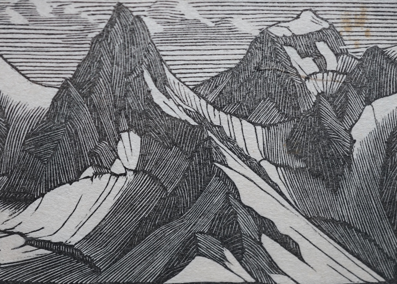 After Gwen Raverat (1885-1957), wood engraving, Mountain landscape, unsigned, inscribed 'by Gwen Raverat from Charles Tennyson, November 1959' and W. Heffer and Sons Gallery label verso, 6 x 8cm. Condition - fair, some d